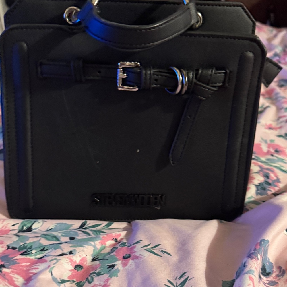 The handbag pictured is the Steve Madden Bevelyn2 Satchel in black